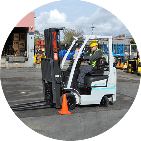 circular image of a student operating a forklift during a training class