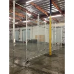 Thumbnail of http://Chain%20link%20fencing%20inside%20of%20an%20empty%20warehouse