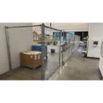 Thumbnail of http://Chain%20link%20fencing%20inside%20of%20a%20warehouse