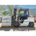 Thumbnail of http://A%20worker%20moving%20a%20pallet%20outside%20using%20a%20unicarriers%20pf%20series%20forklift